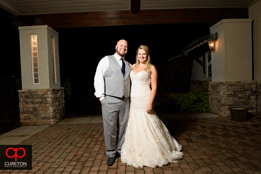 Married couple standing outside the sawmill.