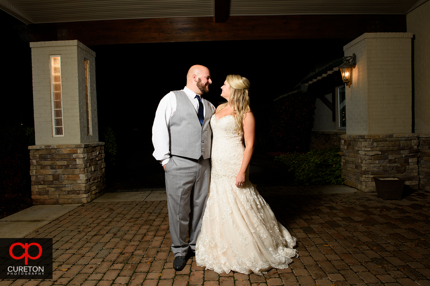 Married couple standing outside the sawmill.