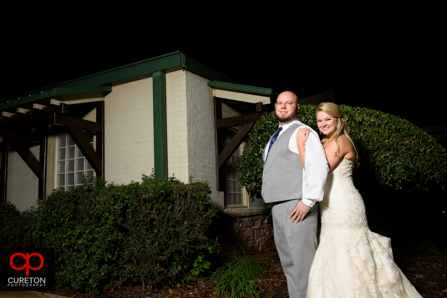 Married couple standing outside the sawmill.