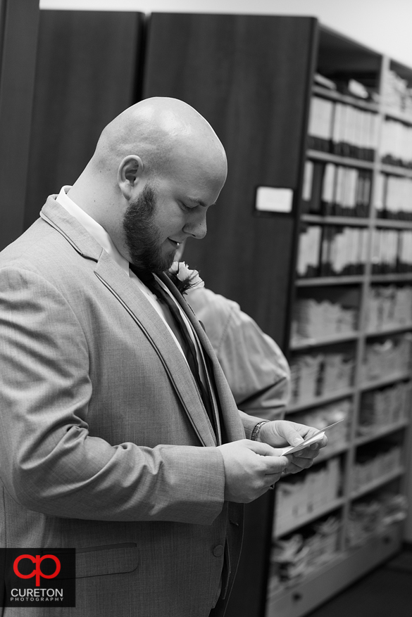 Groom reading letter.