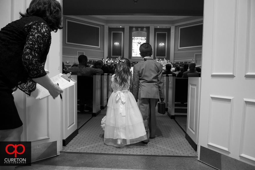 Flower girl walking down the aisle.