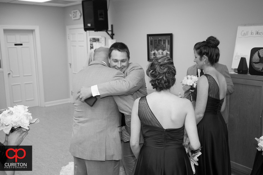 Couple congratulated after ceremony.