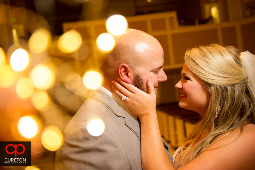 Cool shot of bride and groom with twinkle lights.