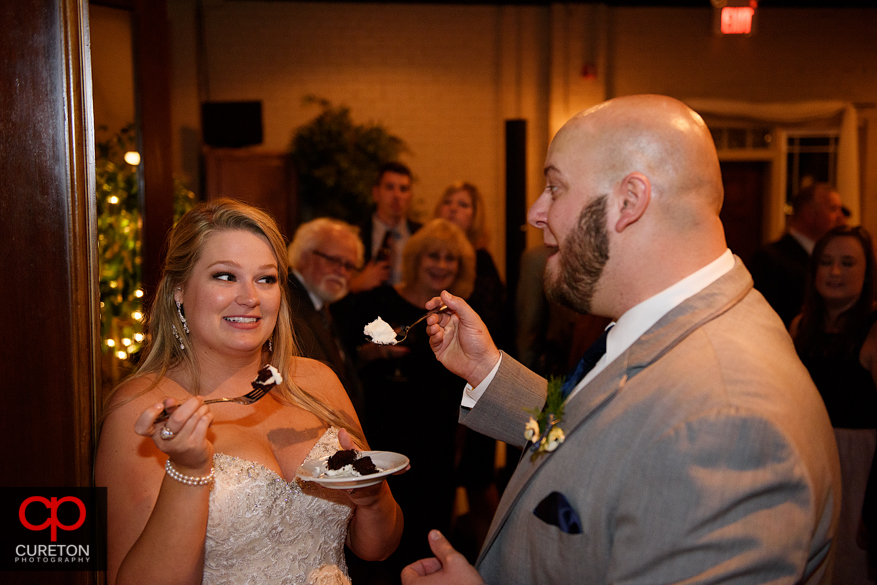 Bride and groom cut cake.