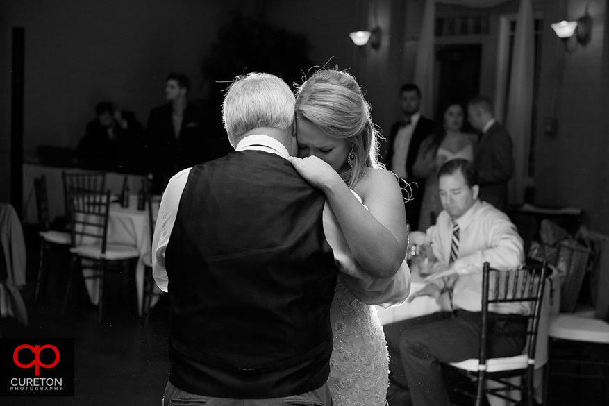 Bride dancing with er father at the reception.