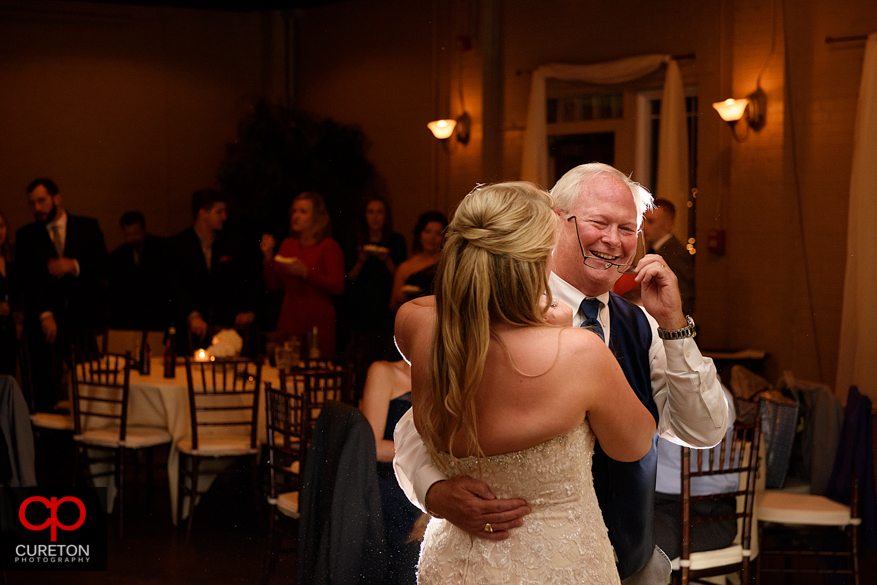 Bride dancing with er father at the reception.