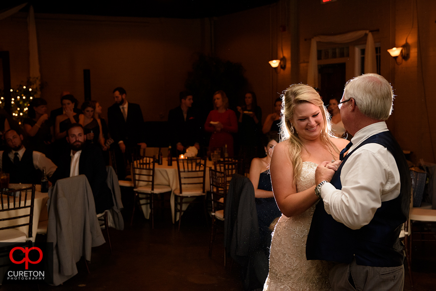 Bride dancing with er father at the reception.