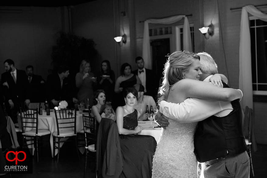 Bride dancing with er father at the reception.