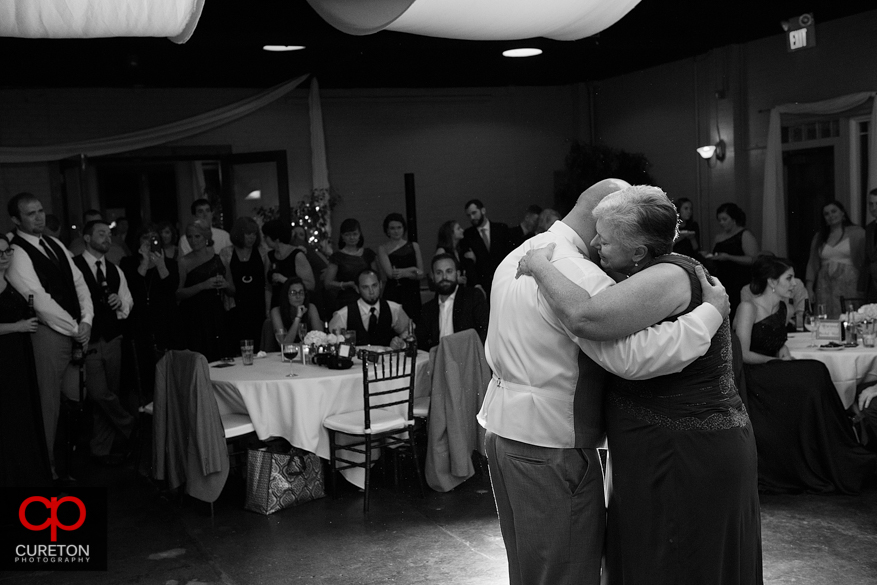 Groom dancing with his mother.
