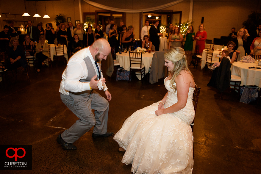 Groom gets the garter.