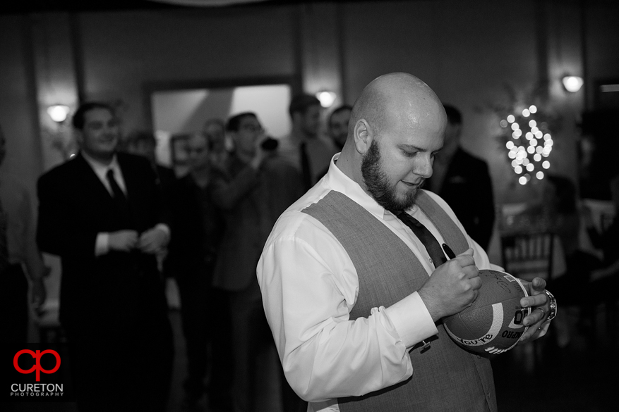 Groom tossing the garter.