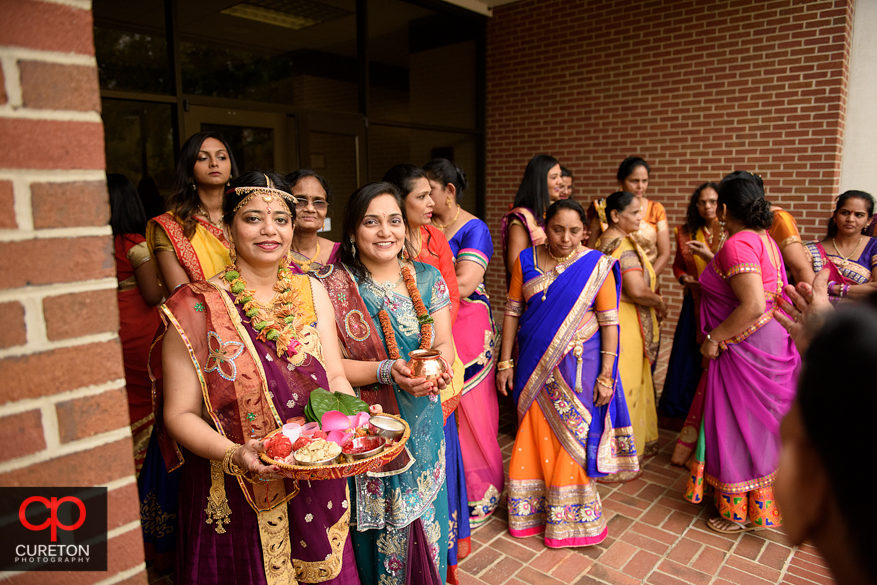 Family participates in a pre Indian wedding Vidhi ceremony at Presbyterian college.