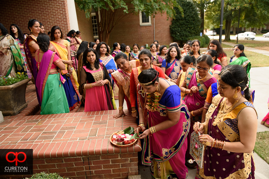 Family participates in a pre Indian wedding Vidhi ceremony at Presbyterian college.
