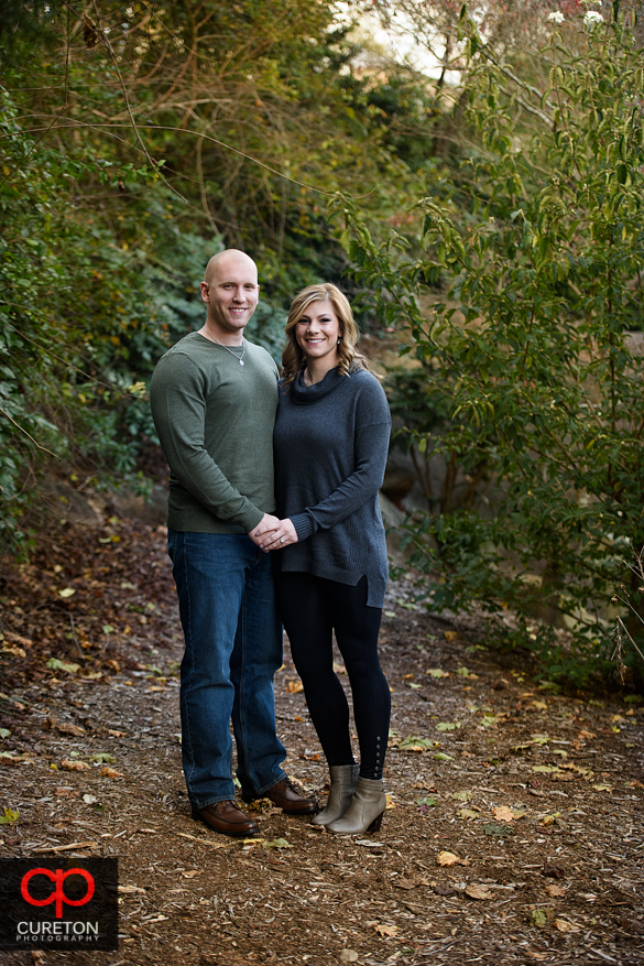 Fall in the rock quarry garden with an engaged couple.