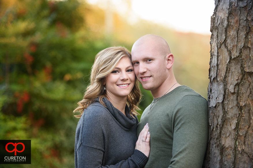 Engaged couple suring the fall season in downtown Greenville,SC.