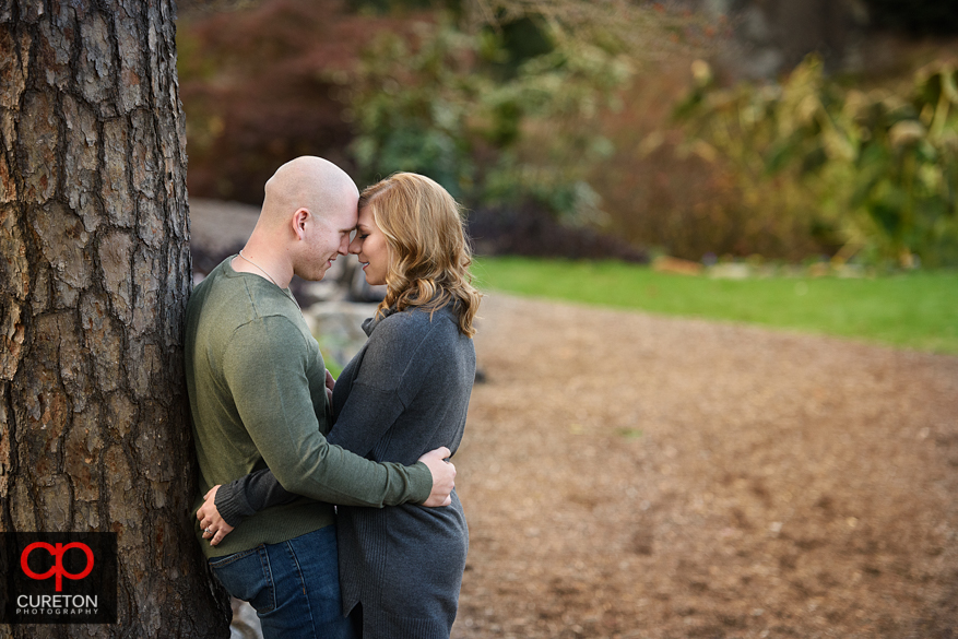 Couple during their engagement session at the rock quarry garden.