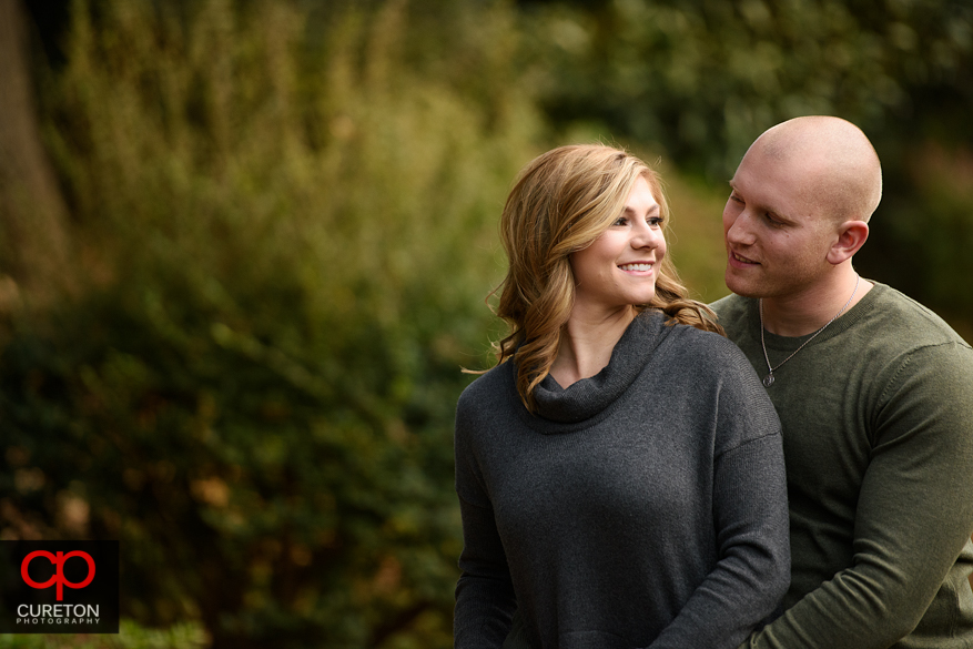 Couple during their engagement session at the rock quarry garden.