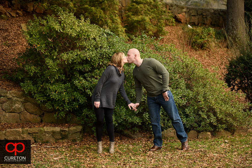 Couple during their engagement session at the rock quarry garden.