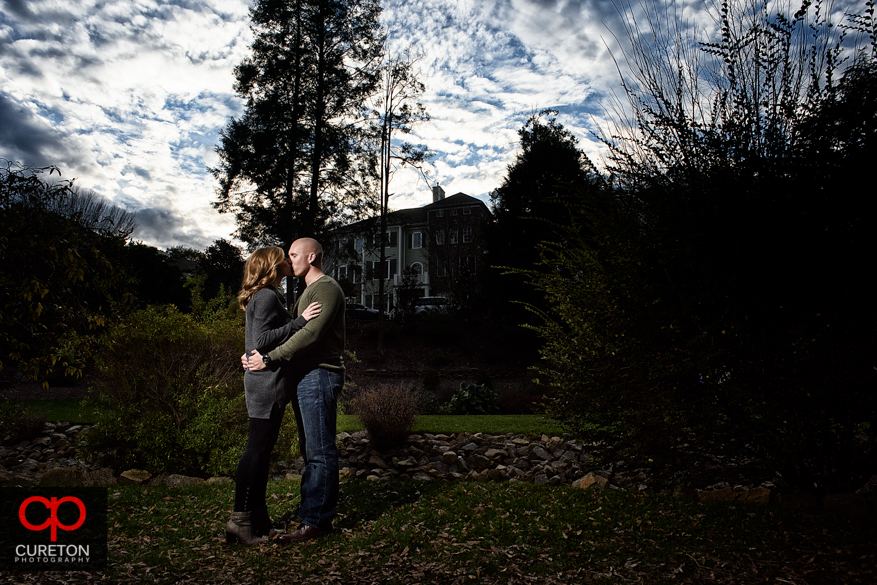 Couple kissing in the park.