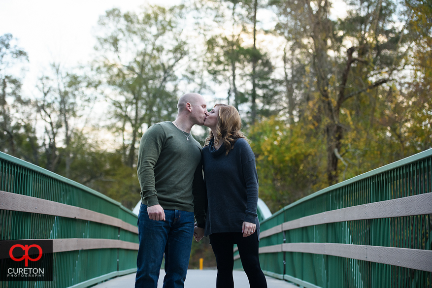 Engaged couple on the bridge at Cleveland Park.