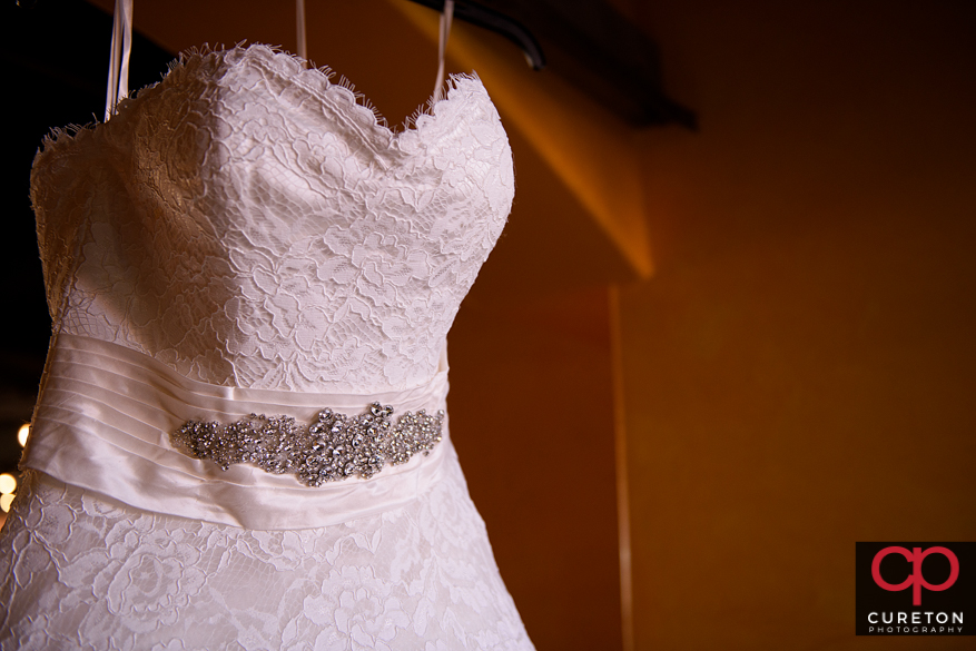 Closeup of bride's dress.