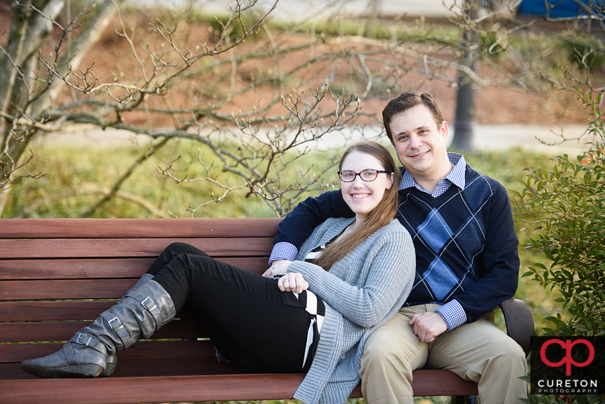 Couple sitting on a bench in Clemson,SC.