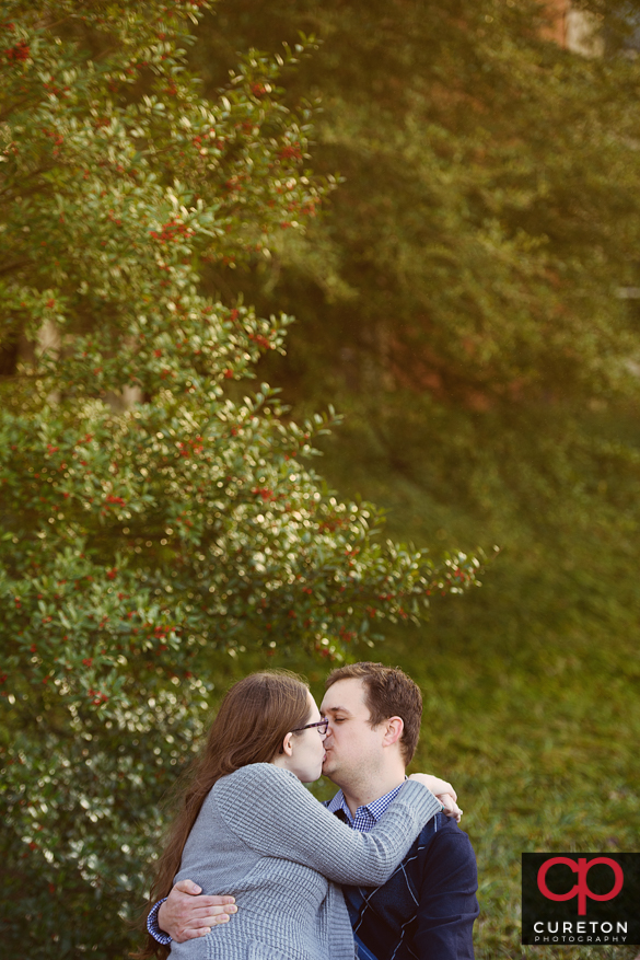Couple kissing during their engagement session.
