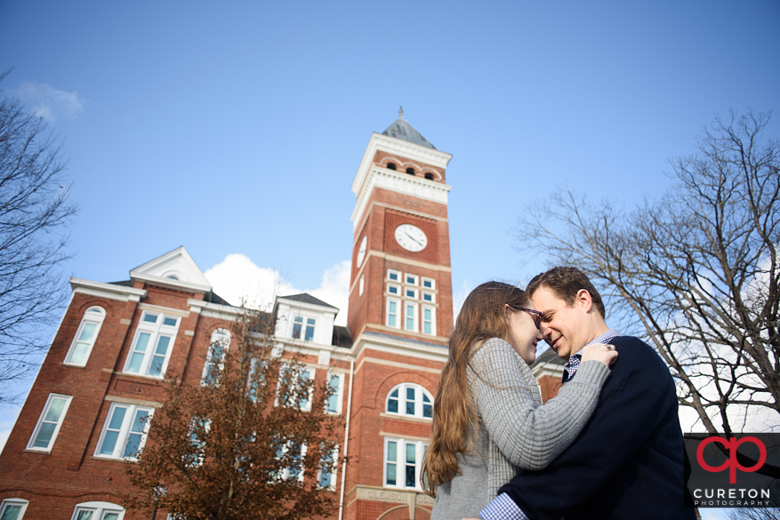Engaged couple in front of Tillman hall.