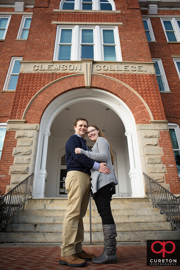 Couple in the archway of Tillman Hall during thier engagement session on the Clemson University campus.