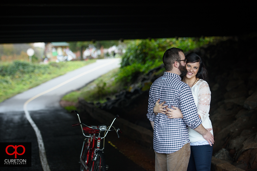 Couple during their engagement session on the Swamp Rabbit Trail in Greenville,SC.