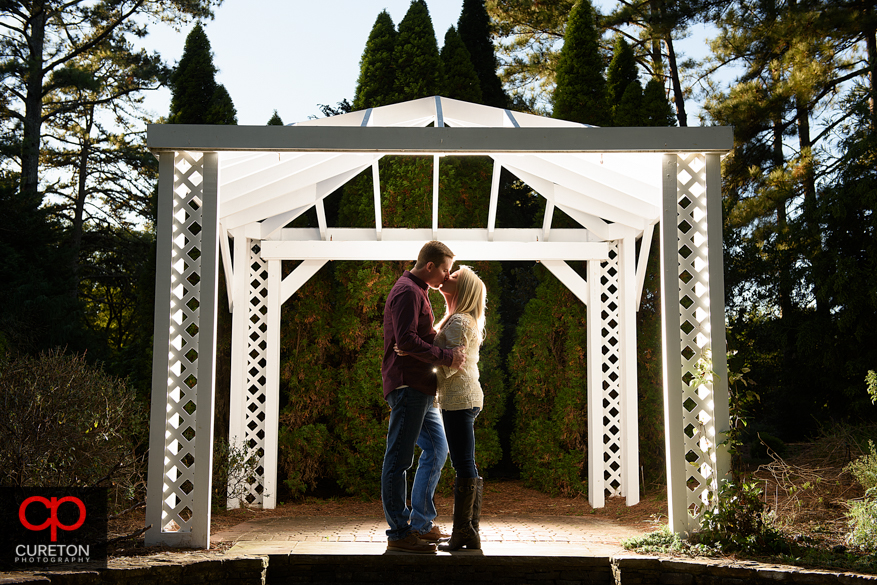 Gazebo kiss at a Botanical Garden engagement session in Clemson,SC.