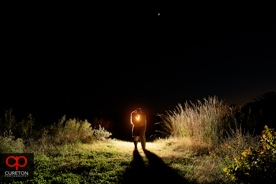 Epic couple kissing at a Botanical Garden engagement session in Clemson,SC..