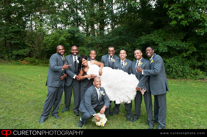 The bride with all of the groomsmen.