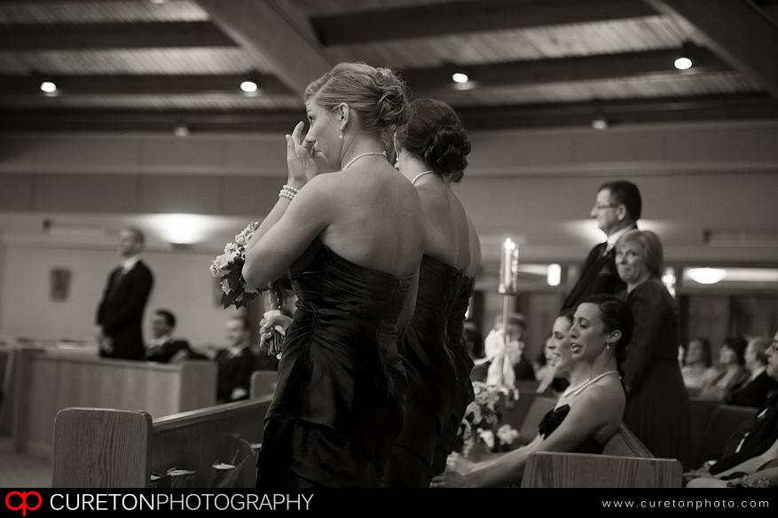 Bridesmaids crying at wedding.