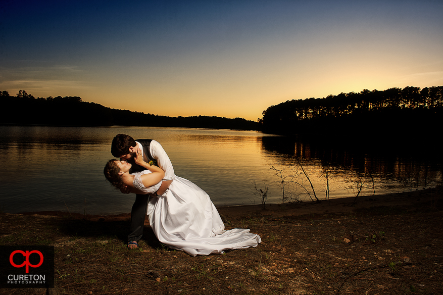 Couple at sunset on Lake Hartwell after their wedding at Clemson Outdoor Lab.