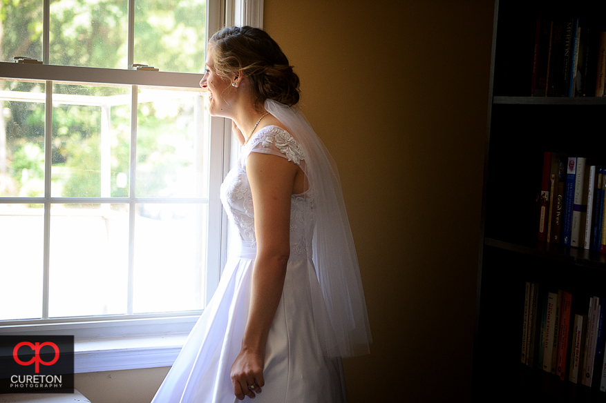 The bride staring out the window.