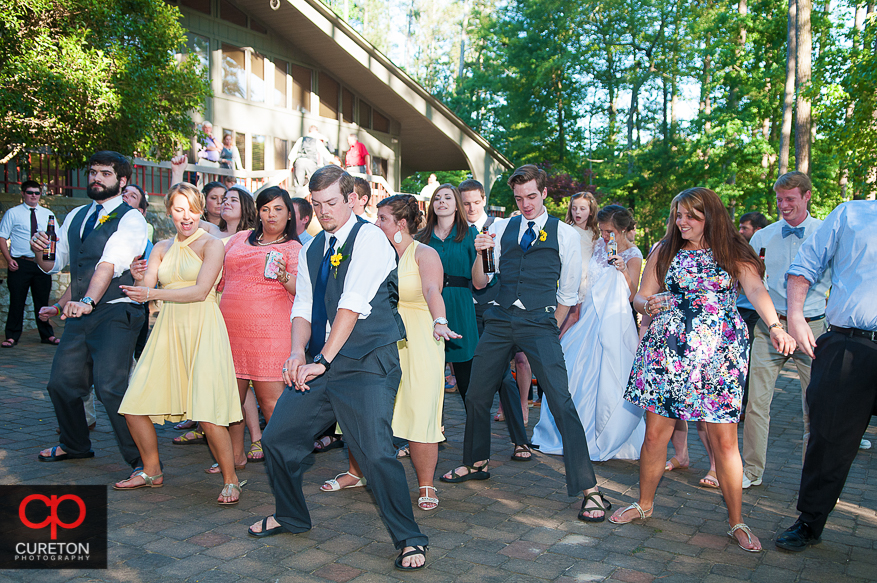 Guests dancing at the wedding reception at the Clemson outdoor lab.