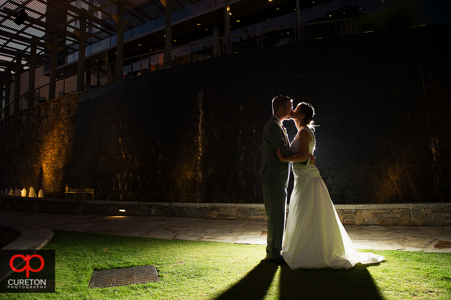 Newly married couple in front of the water wall outside the Peace Center in downtown Greenville,SC.