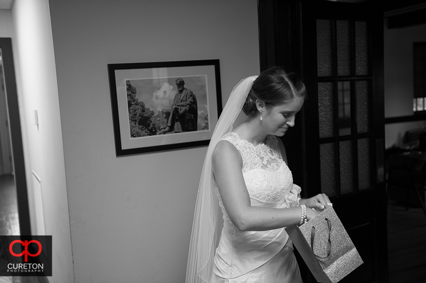 The bride receives a gift from her groom.