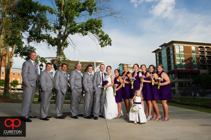 The wedding party standing outside the Huguenot Loft in downtown Greenville.