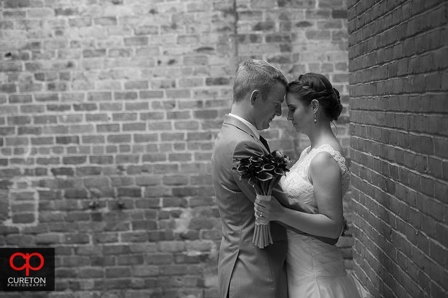 The bride and groom share a moment outside the Huguenot Loft before their wedding reception.