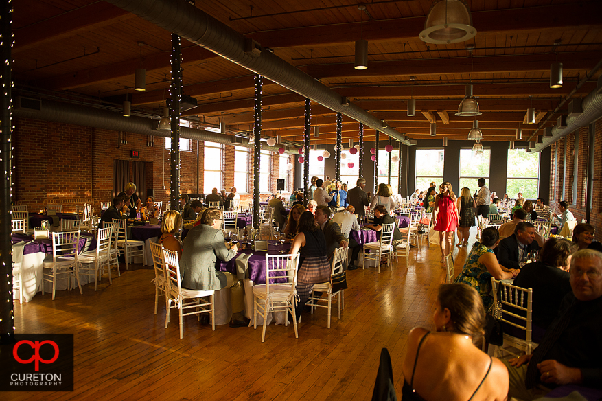 Decor from the downtown Greenville wedding reception with purple color theme.