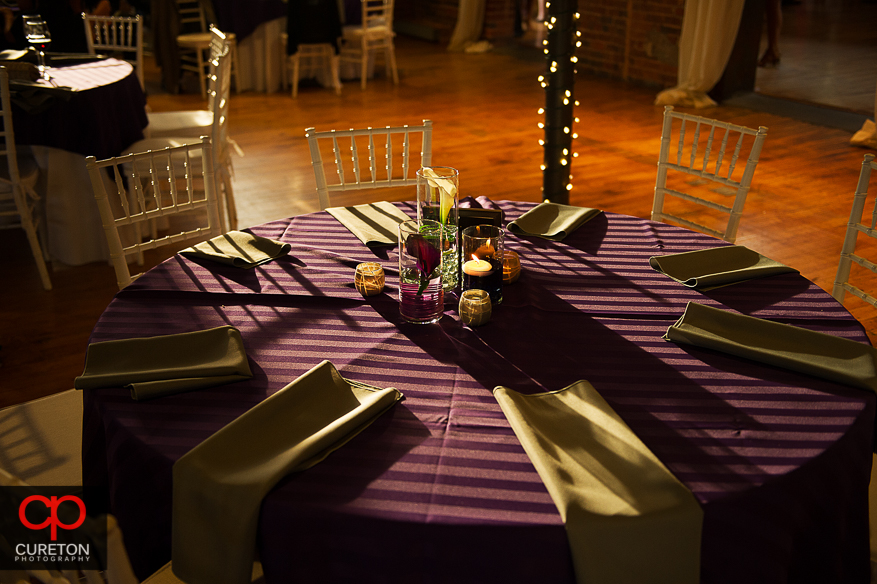 Decor from the downtown Greenville wedding reception with purple color theme.