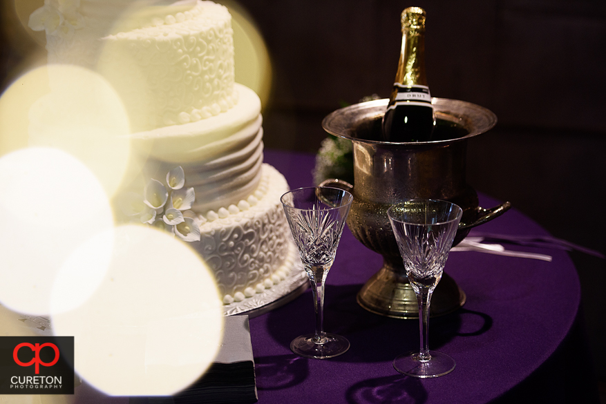 Decor from the downtown Greenville wedding reception with purple color theme.