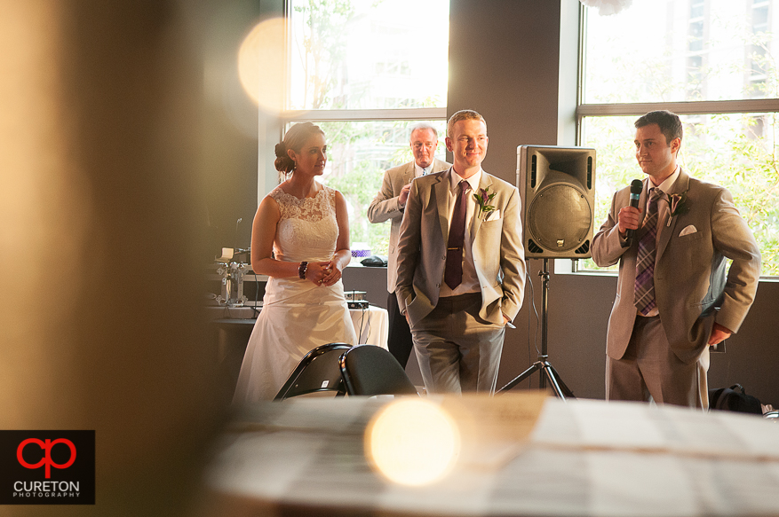 Creative shot of eth best man giving a toast.