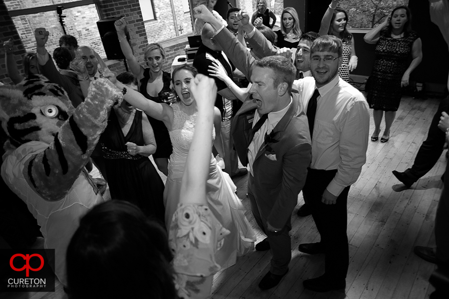 Wedding guest dance with the Clemson tiger.