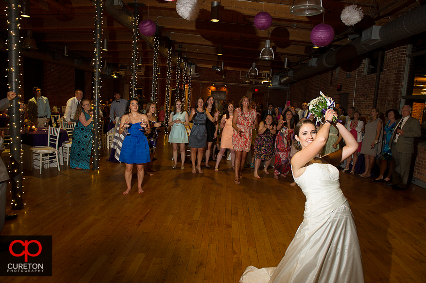 The bride gets ready to toss the bouquet.