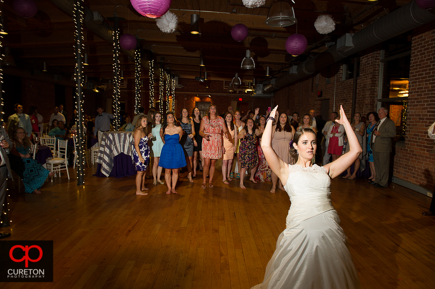 The bride tossing the bouquet.