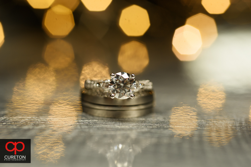 Callous shot of the wedding rings.