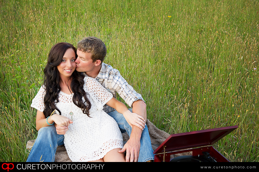 Bride and groom to be in a field.